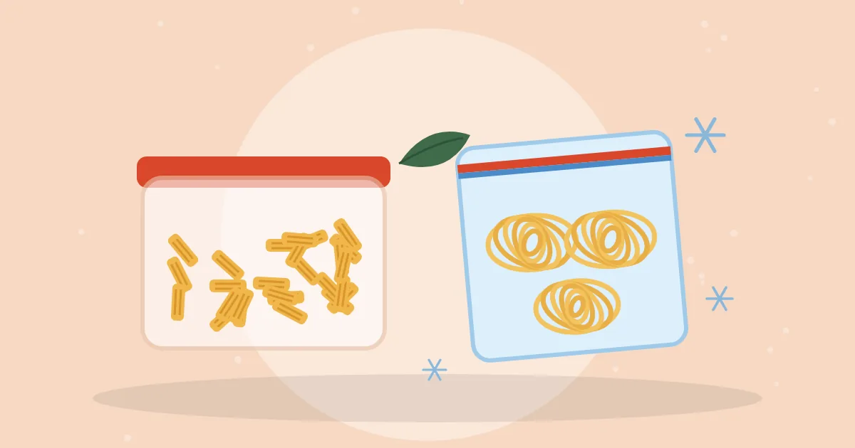 Glass container of cooked penne pasta beside a freezer bag holding spaghetti nests